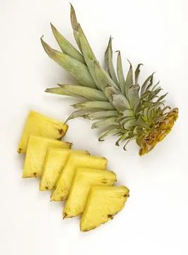 Pineapple slices. Pineapple cut into triangles on a white background, top view. 库存照片