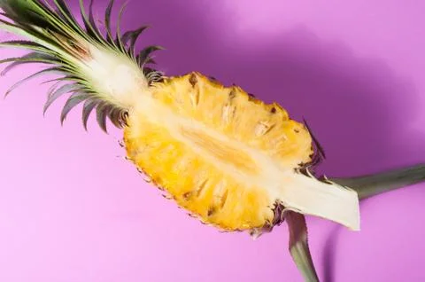 Pineapple with slices on pink background Stock-Fotos