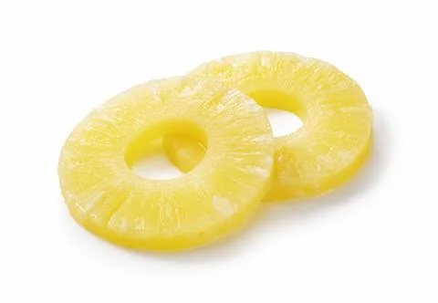 Pineapple slices placed on a white background Stock Photos