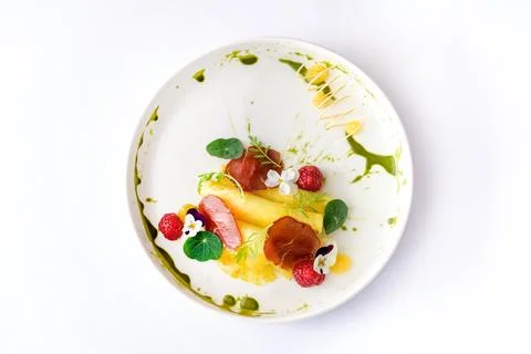 Pineapple slices with prosciutto raspberry and sauce Stock Photos