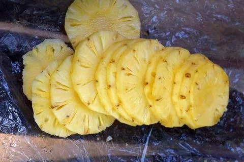 Pineapple slices ready for eat. Pineapple isolate. Cut pineapple. Stock Photos