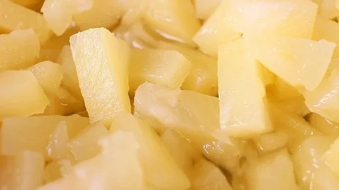 Pineapple slices rotating food texture closeup video footage. Studio lighting. Stock Footage 91041982
