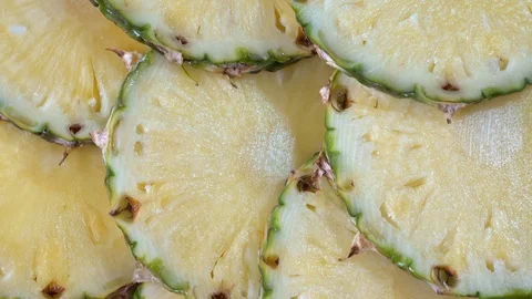 Pineapple slices rotating on a platter Stock Footage 122276076