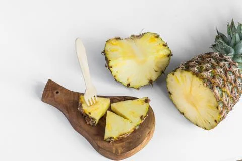Pineapple slices on white background Stock Photos