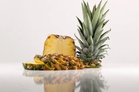 Pineapple with slices on white background. Pineapple, ananas, fruit Stock Photos