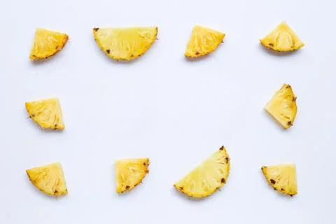 Pineapple slices on white. Stock Photos