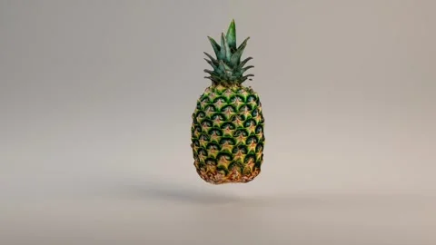 Pineapple slowly spins on a solid white background Stock Footage 295135416