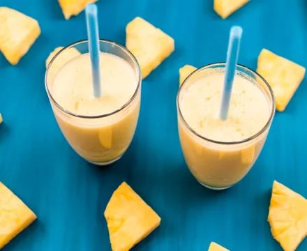 Pineapple smoothie on a blue background Foto stock