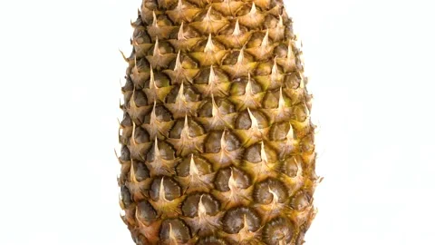 Pineapple spinning and rotating Isolated on white background. Close-up Stock Footage 152779576