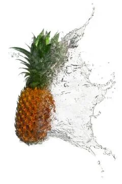 Pineapple splashes on white background Stock Photos