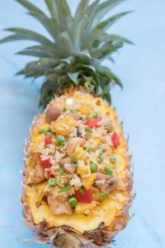 Pineapple stuffed with fried rice, chicken and vegetables Stock Photos