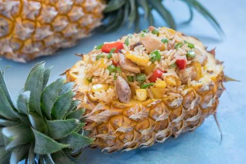 Pineapple stuffed with fried rice, chicken and vegetables Stock Photos