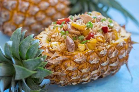 Pineapple stuffed with fried rice, chicken and vegetables Stock Photos