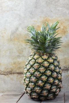 Pineapple with wall background. Stock-Fotos