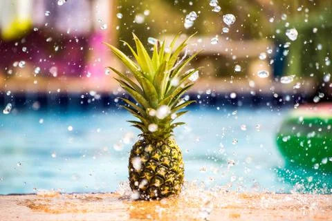 Pineapple with water splash. Stock Photos