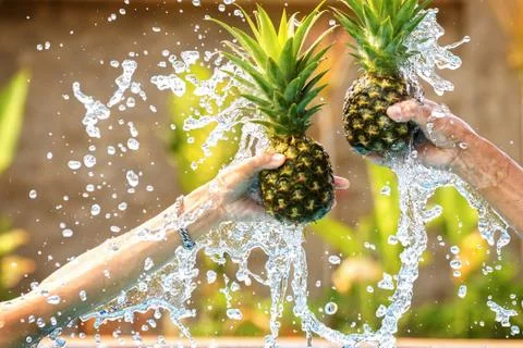Pineapple with water splash. Stock Photos