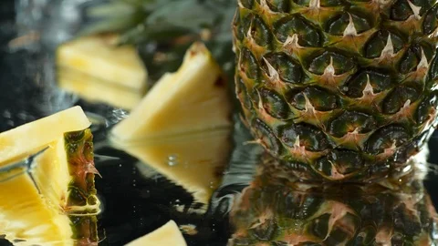 Pineapple in water table. Overhead shot. high speed camera, 4K. Slow Motion. Stock Footage 114895615
