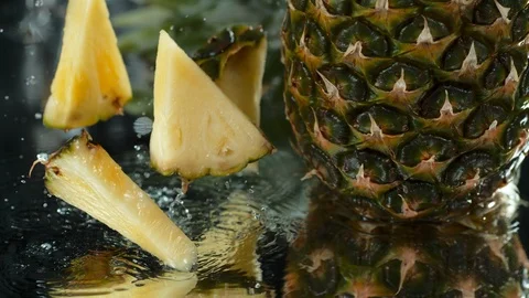 Pineapple in water table. Overhead shot. high speed camera, 4K. Slow Motion. Stock Footage 114896251