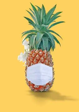 Pineapple wearing white mask for safety concept design isolated Stock Photos