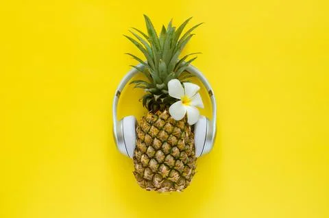 Pineapple wearing wireless headphone 写真素材
