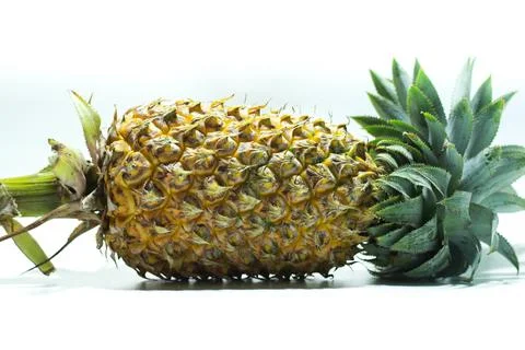 Pineapple on a white background with its sides visible Stock-Fotos