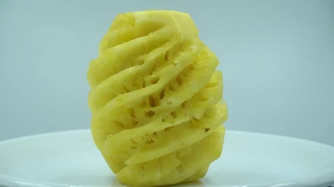 Pineapple with White plate in white background. yellow fruit has a sweet and sou Stock Footage 124023793
