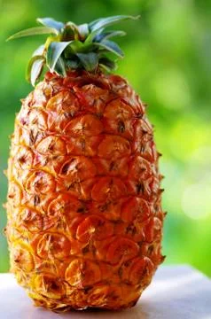 Pineapple on white table Stock Photos