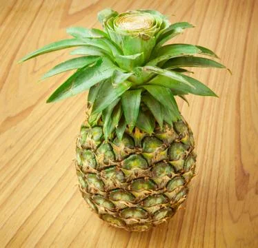 Pineapple on the wood Stock Photos