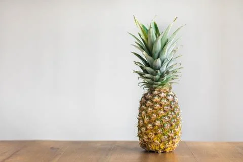 Pineapple on wood Stock Photos