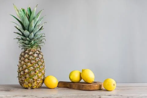 Pineapple on wood Stock Photos