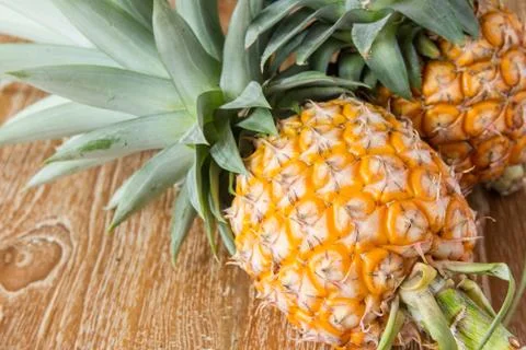 Pineapple on wood table Stock Photos
