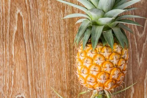 Pineapple on wood table Stock-Fotos