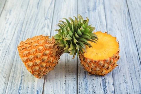 Pineapple on wooden background Stock Photos