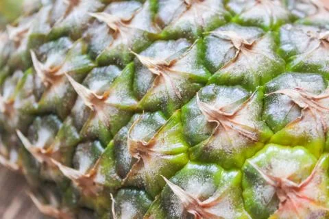 Pineapple on the wooden background surface. Pineapple closeup.. Stock Photos