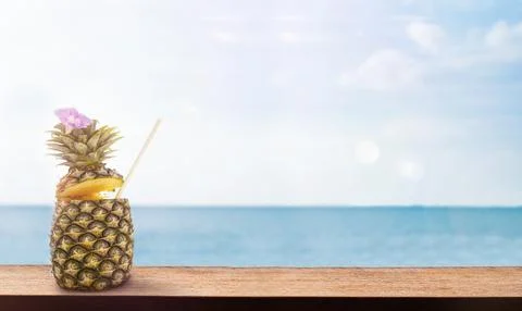 Pineapple on a wooden surface Stock Photos