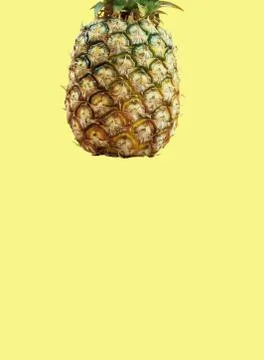Pineapple with yellow background. Stock Photos