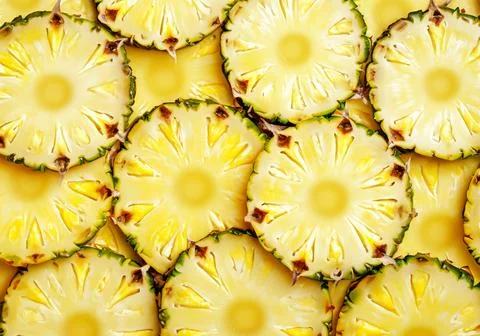 Pineapple yellow slices background. Stock Photos