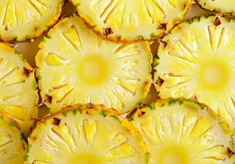 Pineapple yellow slices background. Stock Photos