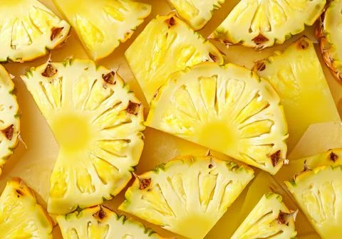 Pineapple yellow slices background. Stock Photos