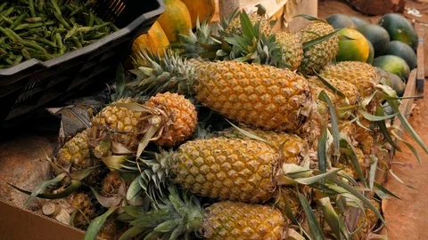 Pineapples on indian fruit and vegetable market in Goa Stock Footage 126417143