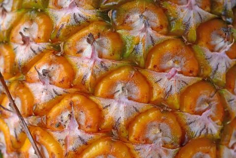 Pineapple's surface a background Stock Photos