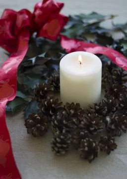 Pinecones and a candle Stock Photos