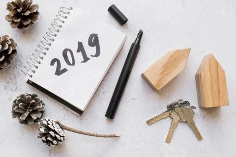 Pinecones keys wooden house blocks 2019 written notepad with felt tip pen white 스톡 사진