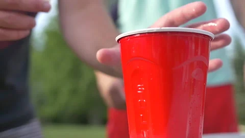 Ping pong ball bounce in cup during drinking game Stock Footage 152581022