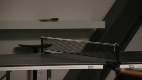 Ping pong ball bouncing back and forth across table Stock Footage 103868358