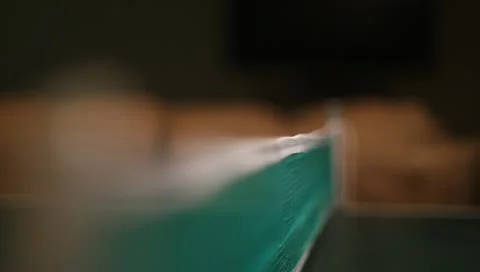 Ping pong ball going over net during play Video stock 10902909