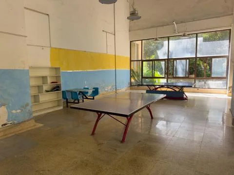 Ping pong tables in empty indoor recreation room Stock Photos