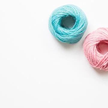 Pink and green string roll thread reel isolated on white background Stock Photos