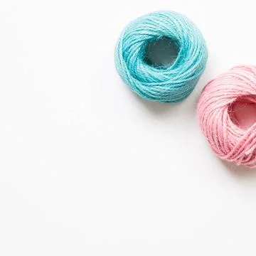 Pink and green string roll thread reel isolated on white background Pink a... Stockfoto's