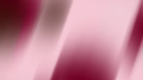 Pink and maroon diagonal gradients create a blurred abstract backdrop. Stock Footage 307652428